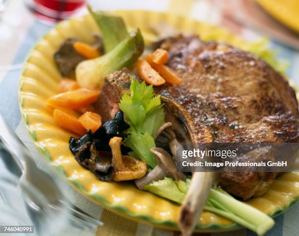 veal chop with mushrooms, carrots and celery - auricularia auricula judae stock pictures, royalty-free photos & images