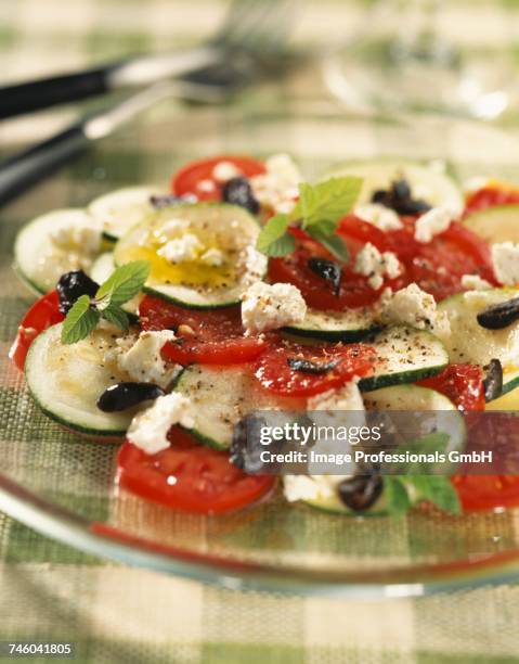 zucchini carpaccio with feta and tomatoes - fetta - fotografias e filmes do acervo