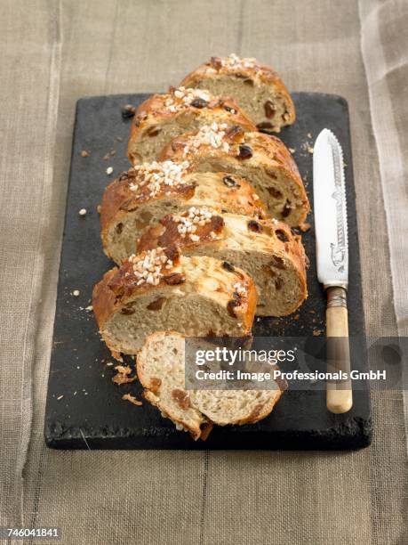 raisin and walnut brioche -style bread - raisin bread stock pictures, royalty-free photos & images