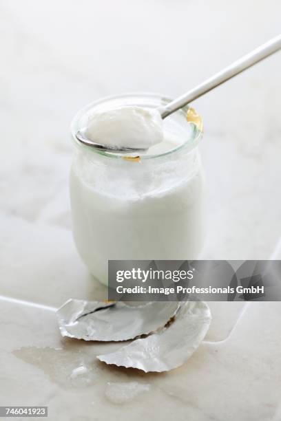 plain yoghurt - yoghurt lid stock pictures, royalty-free photos & images