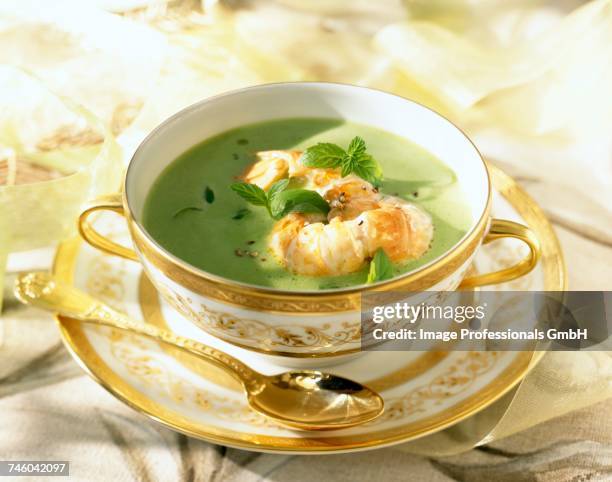 creamed pea soup with dublin bay prawns - pea and mint soup stock pictures, royalty-free photos & images