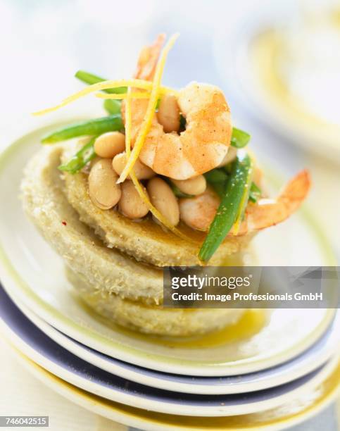 artichoke hearts and bases with prawns and shell beans - gambas ストックフォトと画像