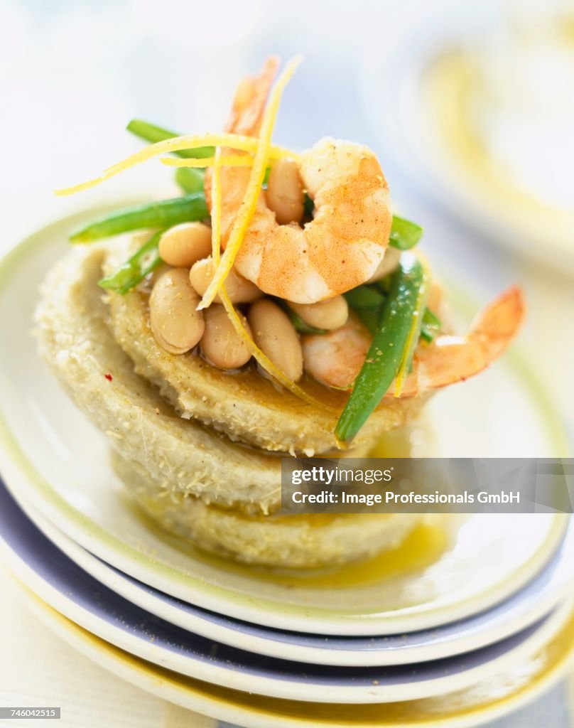 Artichoke hearts and bases with prawns and shell beans