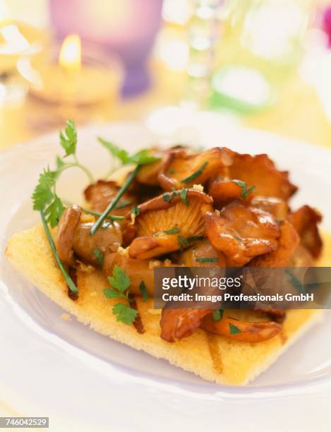 pan-fried mushrooms on toast - cantharellus tubaeformis stock pictures, royalty-free photos & images