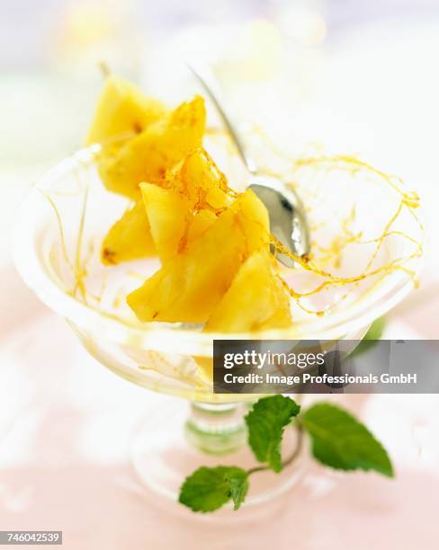 pineapple with caramel kebabs - caramel block stock pictures, royalty-free photos & images