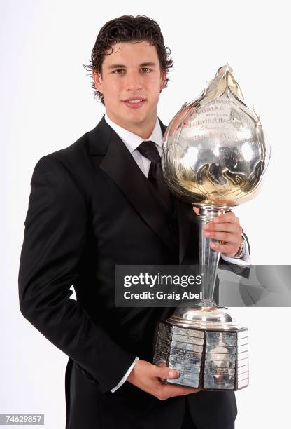 Sidney Crosby of the Pittsburgh Penguins poses for a portrait backstage with the Hart Memorial Trophy during the 2007 NHL Awards at the Elgin Theatre...