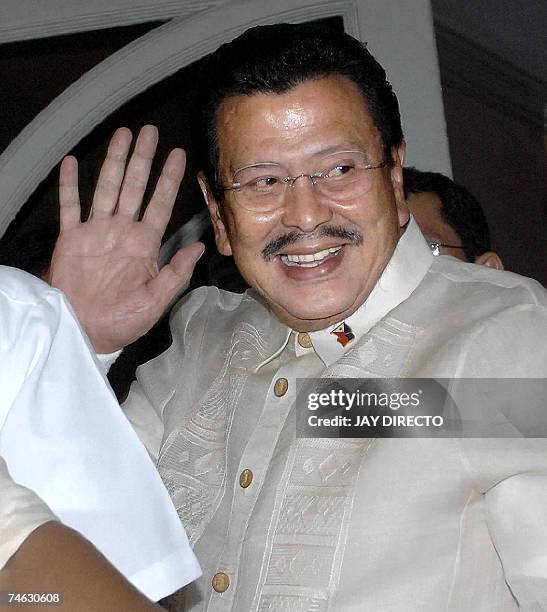 Deposed president Joseph Estrada waves as he enters the courtroom where he will face the summation of the graft charges against him in Manila, 15...