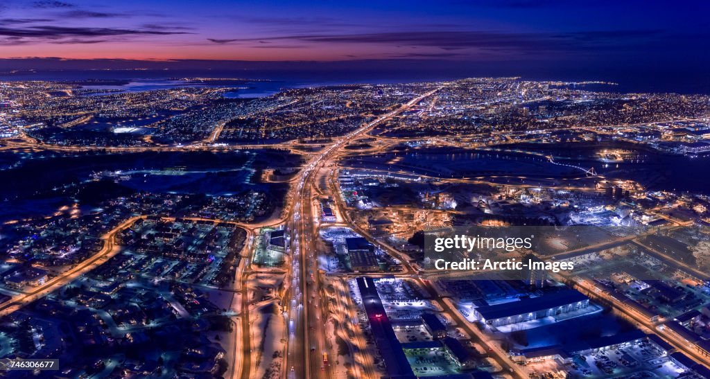 Top view of roads, homes, buildings at twilight, wintertime, Reykjavik, Iceland. This image is shot with a drone.