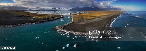 aerial view of icebergs in jokulsarlon, breidamerkurjokull, vatnajokull ice cap, iceland. this image is shot with a drone.  - breidamerkurjokull glacier stock pictures, royalty-free photos & images