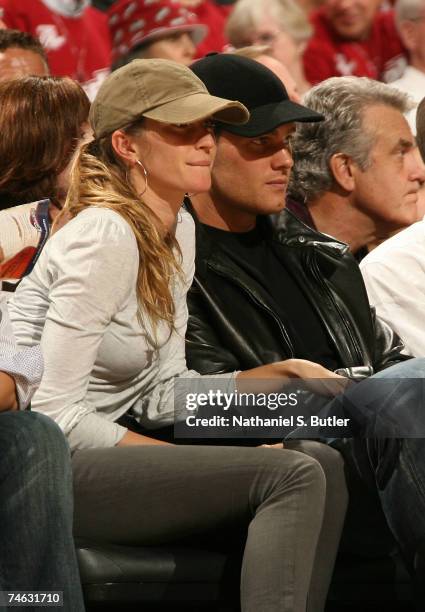 Model Gisele Bundchen and New England Patriots quarterback Tom Brady sit courtside for Game Four of the NBA Finals between the Cleveland Cavaliers...