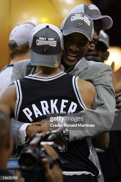 Tony Parker of the San Antonio Spurs hugs his father Tony Parker Sr. After the win against the Cleveland Cavaliers in Game Four of the NBA Finals on...