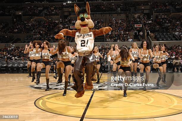 The San Antonio Spurs Coyote and the Silver Dancers perform as fans watch the San Antonio Spurs take on the Cleveland Cavaliers at a viewing party at...
