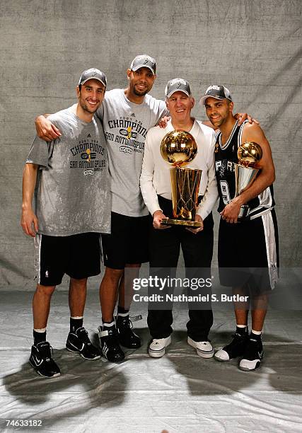 Manu Ginobili, Tim Duncan, head coach Gregg Popovich and Finals MVP Tony Parker of the San Antonio Spurs pose for a photo with the Larry O'Brien...