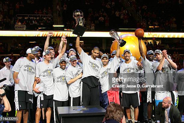 The San Antonio Spurs celebrate with the Larry O'Brien NBA Championship Trophy after their 83-82 win against the Cleveland Cavaliers in Game Four of...