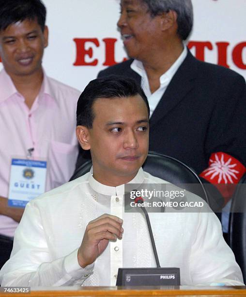 Newly proclaimed senator, detained Philippine navy lieutenant Antonio Trillanes, listens to questions at a press conference following his oath taking...