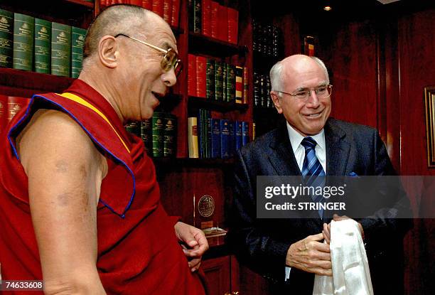 Australian Prime Minister John Howard greets the Dalai Lama at they meet in Sydney, 15 June 2007. Howard met the Dalai Lama, who is in Australia on a...