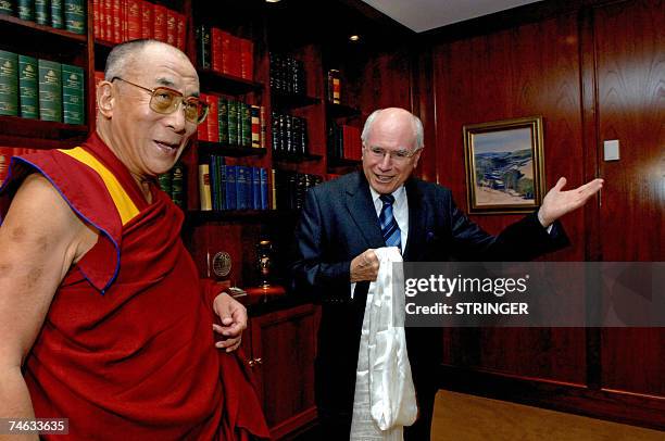 Australian Prime Minister John Howard gestures as he meets with the Dalai Lama in Sydney, 15 June 2007. Howard met the Dalai Lama, who is in...