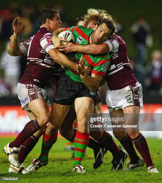 Paul Mellor of the Rabbitohs is tackled during the round 14 NRL match between the Manly Warringah Sea Eagles and the South Sydney Rabbitohs at...