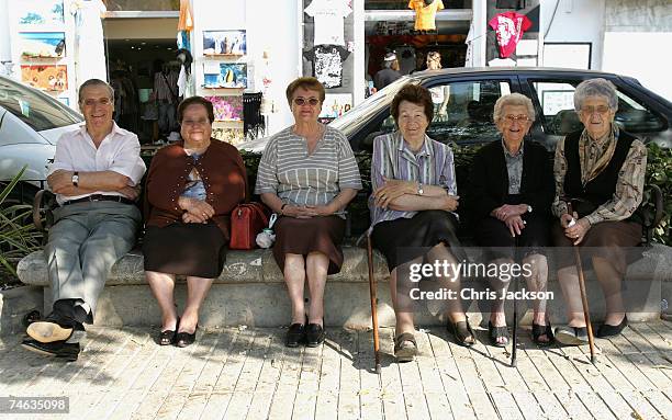 Ibiza residents take a break in the main square in Eivissa Old Town on June 7, 2007 in Spain Ibiza. Ibiza remains one of the world's top holiday...