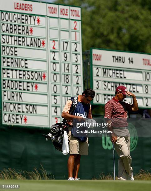 Tom Pernice Jr. Waits to hit a shot on the 15th hole with his caddie Brett Waldman during the second round of the 107th U.S. Open Championship at...