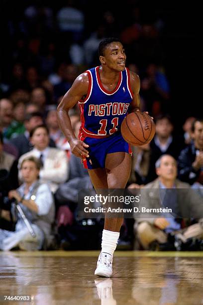 Isiah Thomas of the Detroit Pistons dribbles up court during a 1989 NBA game. NOTE TO USER: User expressly acknowledges that, by downloading and or...