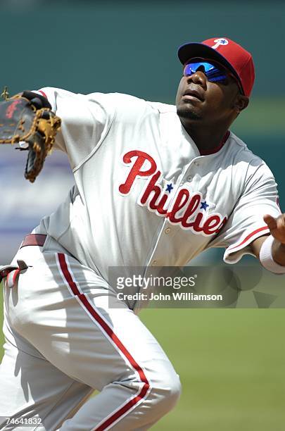 First baseman Ryan Howard of the Philadelphia Phillies fields his position as he runs after a pop fly during the game against the Kansas City Royals...