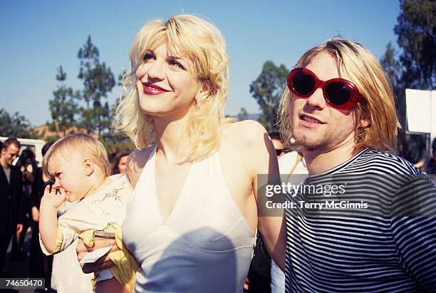 Kurt Cobain of Nirvana with wife Courtney Love and daughter Frances Bean Cobain at the Universal Ampitheater in Universal City, California
