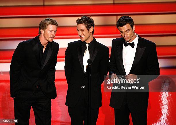 Actors Daniel Goddard, Michael Graziadei, and Thad Luckinbill present the Emmy for "Outstanding Younger Actress in a Drama Series" onstage during the...
