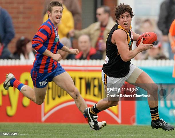 Brett Robinson of Werribee gets away from his opponent during the round ten VFL match between Port Melbourne and the Werribee Tigers at Teac Oval...