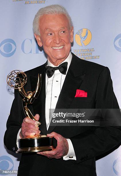 Game Show Host Bob Barker poses with his Emmy for "Outstanding Game Show Host" in the press room during the 34th Annual Daytime Emmy Awards held at...