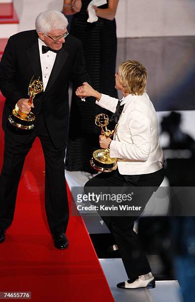 Comedian/host Ellen DeGeneres accepts the Emmy for "Outstanding Talk Show" from Phil Donahue onstage during the 34th Annual Daytime Emmy Awards held...