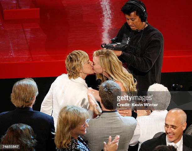 Comedian/host Ellen DeGeneres and actress Portia Di Rossi kiss in the audience after "The Ellen DeGeneres Show" is announced as the winner of...