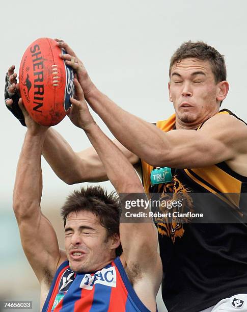 Wayde Skipper of Werribee flies to take a mark over David Spriggs of Port Melbourne during the round ten VFL match between Port Melbourne and the...