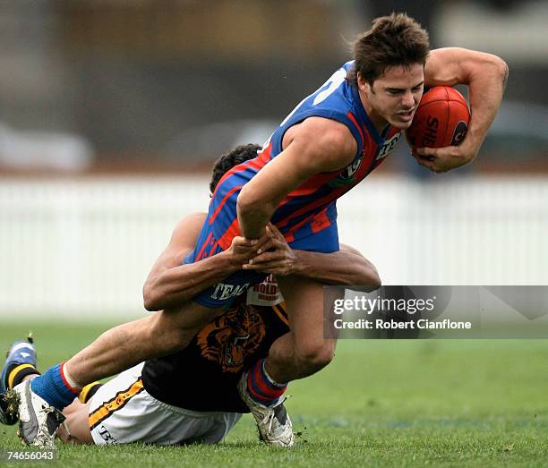 David Spriggs of Port Melbourne is tackled by his opponent during the round ten VFL match between Port Melbourne and the Werribee Tigers at Teac Oval...