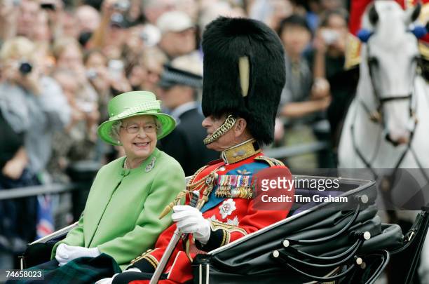 Queen Elizabeth II and Prince Philip, Duke of Edinburgh ride in the carriage procession at Trooping the Colour on June 16, 2007 in London, England.