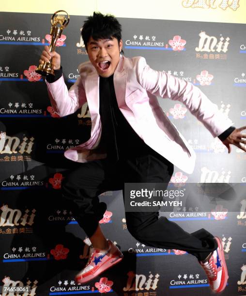 South Korean singer Nicky L jumps in the air for a photo after winning the Best Male Vocalist-Mandarin award during the 18th Golden Melody Awards in...