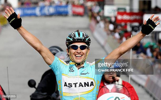 Kazak Maxim Eglinskly raises his arms in victory as he crosses the finish line of the Dauphine Libere cycling race sixth stage, between Gap and...