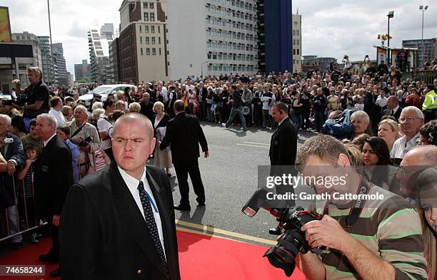 Crowds gather outside Manchester Cathedral during the wedding of footballer Gary Neville and Emma Hadfield on June 16, 2007 in Manchester, England.