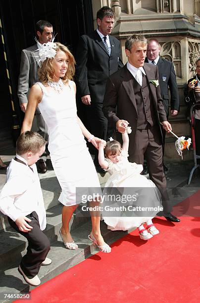 Julie Killilea and Phill Nevile leave Manchester Cathedral after the wedding of footballer Gary Neville and Emma Hadfield on June 16, 2007 in...