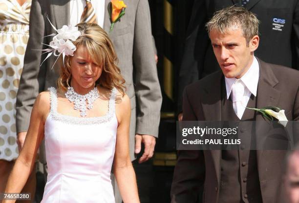 Manchester, UNITED KINGDOM: Everton and England footballer Phil Neville and his wife Julie Killilea Neville leave Manchester's Cathedral, north west...