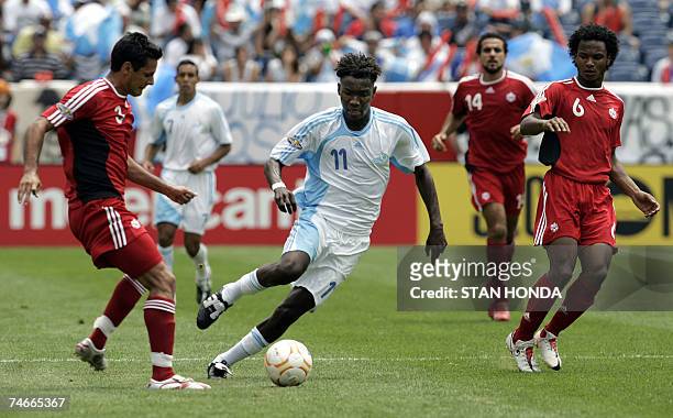 Foxborough, UNITED STATES: Marvin Avila of Guatemala control balls against Ante Jazic of Canada during a quarterfinal game at the CONCACAF Gold Cup...