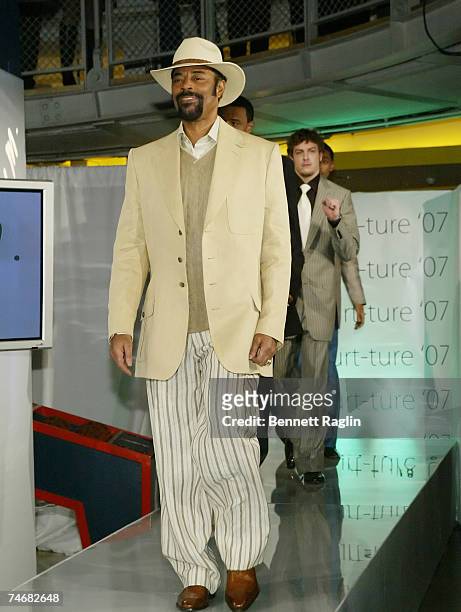 Walt "Clyde" Frazier modeling Jared M. At the NBA Store in New York, New York