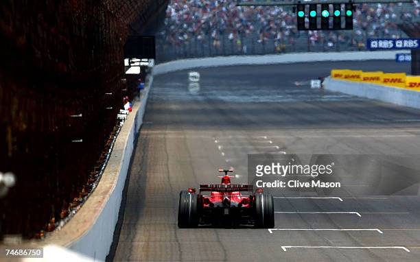 Felipe Massa of Brazil and Ferrari drives during qualifying for the F1 Grand Prix of USA at the Indianapolis Motor Speedway on June 16, 2007 in...
