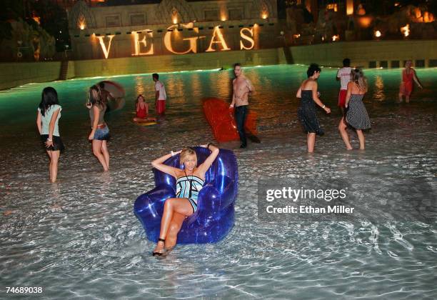 Guests, including former Miss Nevada USA 2007 Katie Rees (C, dance during the fourth anniversary party for Vegas Magazine on the closing night of the...