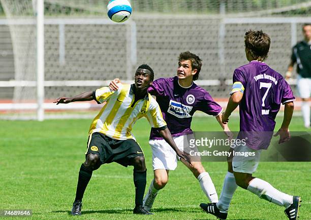 June 17: Dortmunds Victor Huschka and Berlins Emre Tuhran and Lucas Zoppke fight for the ball during the B Juniors match between Tennis Borussia...