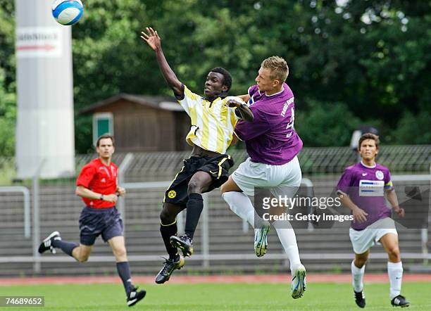 June 17: Dortmunds Victor Huschka and Berlins Dennis Osandchenko fight for the ball while Lucas Zoppke watches the action during the B Juniors match...