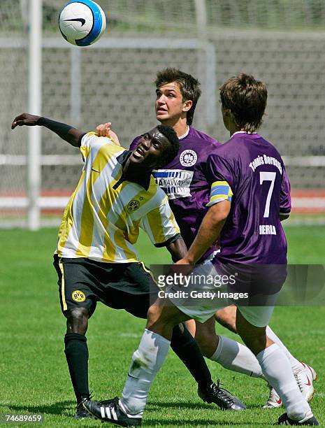 June 17: Dortmunds Victor Huschka and Berlins Emre Tuhran and Lucas Zoppke fight for the ball during the B Juniors match between Tennis Borussia...