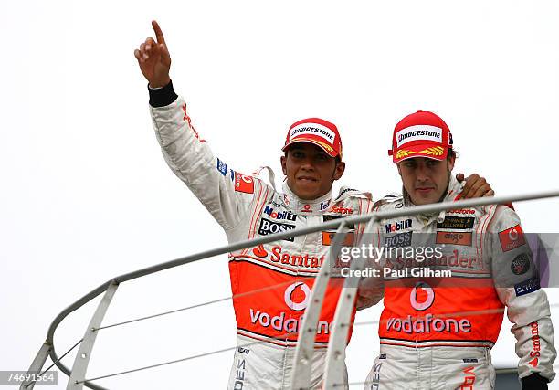 Lewis Hamilton of Great Britain and McLaren Mercedes and Fernando Alonso of Spain and McLaren Mercedes celebrates after coming in first and second in...