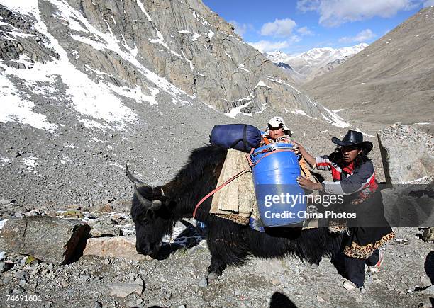 Tibetan nomads arrive at the snow-capped Kangrinboqe Mountain, known as Mt. Kailash in the West, June 16, 2007 in Purang County of Tibet Autonomous...