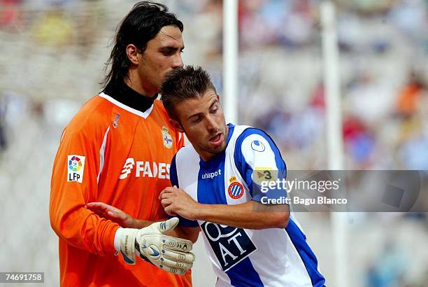 Luis Garcia of Espanyol and Dudu Awat of Deportivo in action during the La Liga match between Espanyol and Deportivo at the Lluis Companys stadium on...